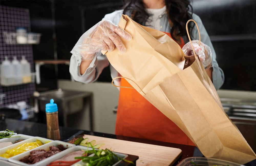 Takeaway food with excess packaging compared to healthier home-cooked meals.